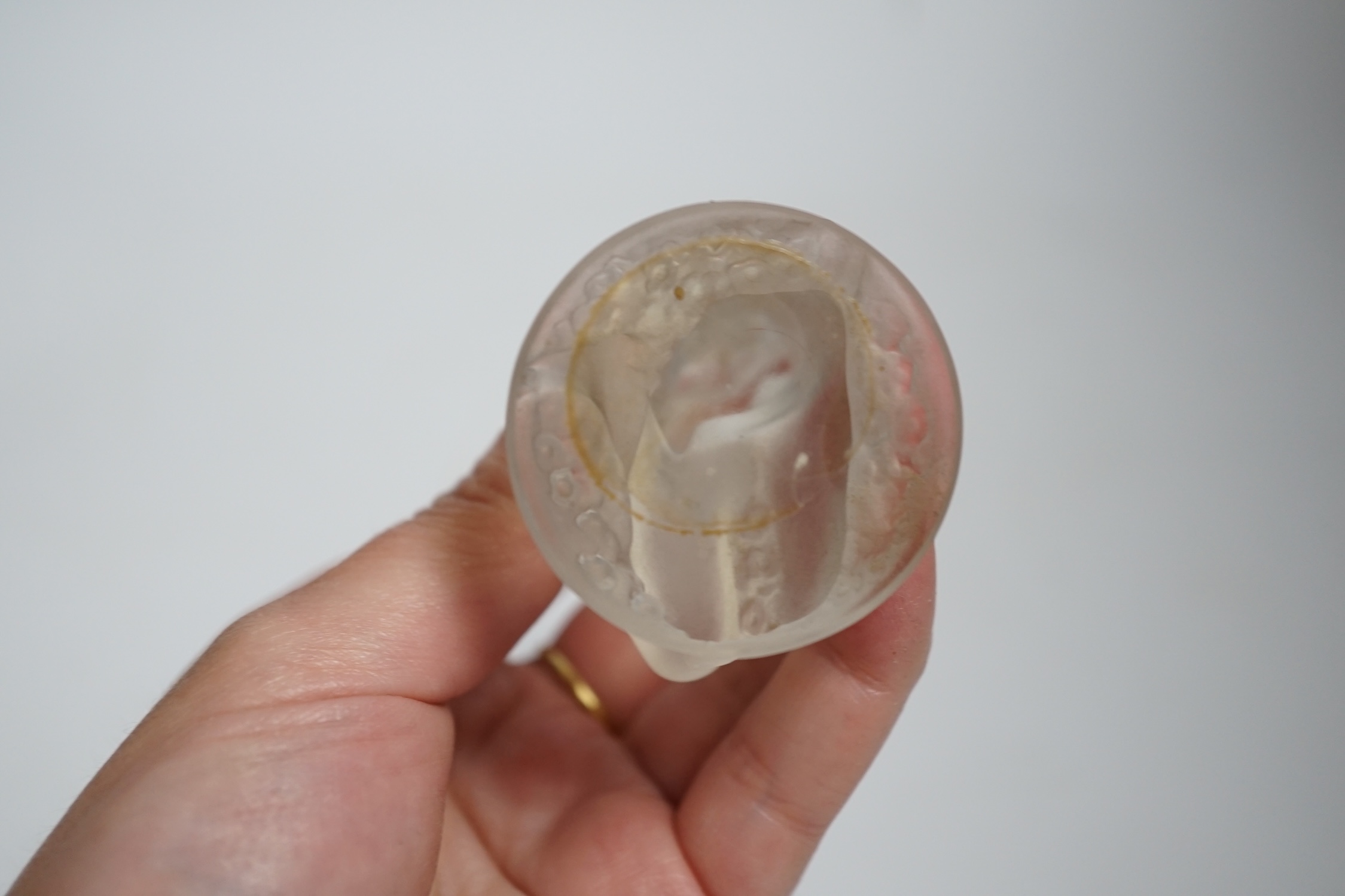 A Lalique glass figure of a kneeling female, signed, 8cm high